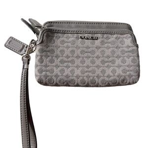 Signature Coach Grey fabric wristlet, two pocket, corner zip. Silver hardware.